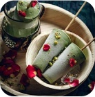 Two cones of green ice cream on a plate
